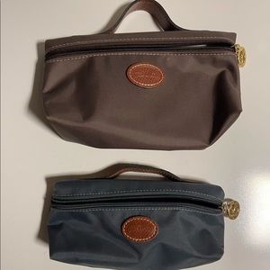 Longchamp makeup bags brown and slate.